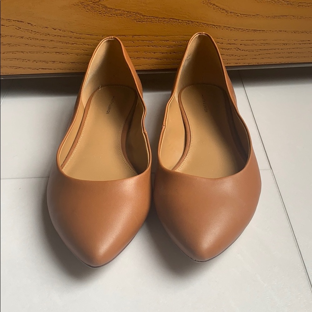 Gently worn brown leather flats
